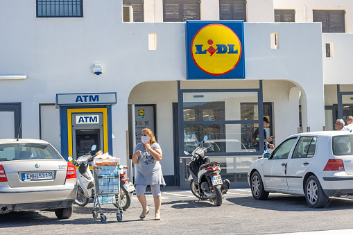 Lidl near Firá on Santorini in South Aegean Islands, Greece, with customers visible outside