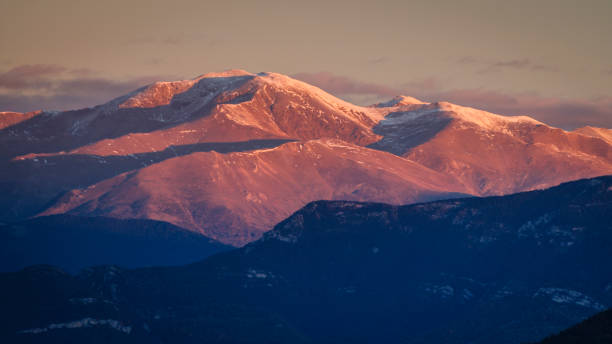 Sunrise in the Bellmunt viewpoint. Views of the Pyrenees and the Puigmal summit (Osona, Barcelona province, Catalonia, Spain, Pyrenees) stock photo