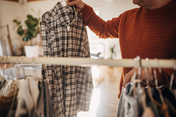 istock A man chooses clothes at home 1360942064