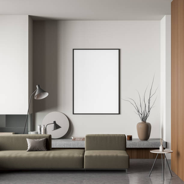 istock Frame on wall in light beige living room with dark green sofa 1360954843