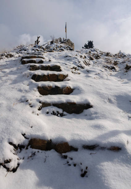 Stairs up to the Mirador la Gargallosa viewpoint, in Gisclareny, after a winter snowfall (Berguedà, Catalonia, Spain, Pyrenees) stock photo