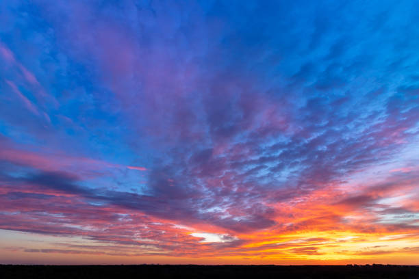 istock Colorful sunset with clouds in the evening 1360974761