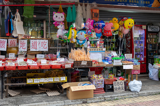 Hong Kong - December 26, 2021 : A shop selling local food at Sai Kung Town in New Territories, Hong Kong.