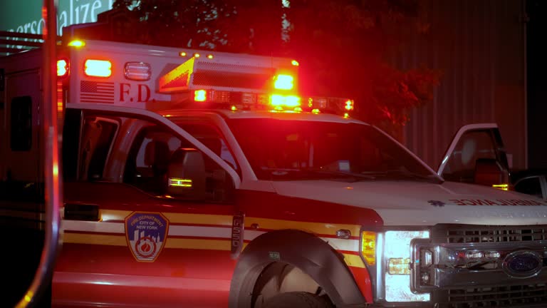 ambulance vehicle lights flashing Police car siren on neighborhood. wide view