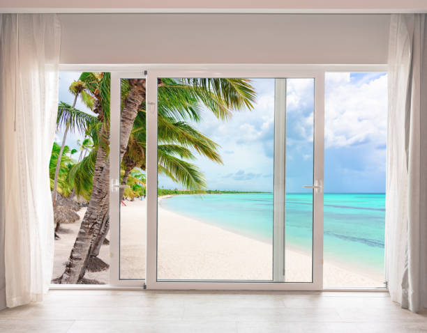 istock large glass door overlooking the beach 1361008642
