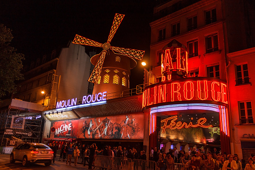 Paris, France - June 14, 2013: The famous cabaret Moulin Rouge. View of the Moulin Rouge at night.
