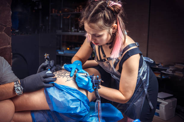 istock Master tattooist works in tattoo studio 1361016728