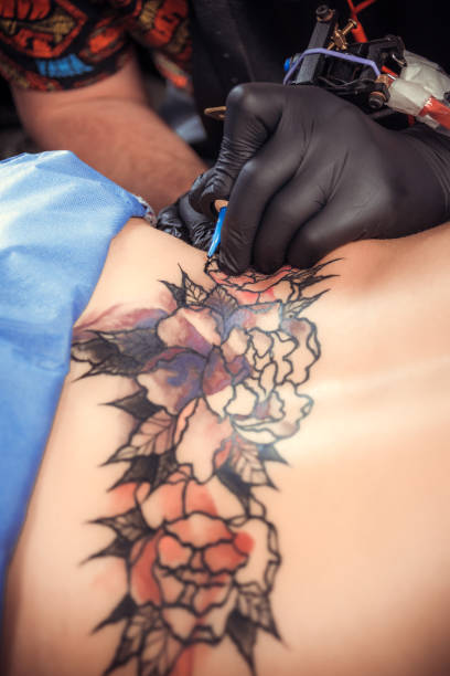 istock Skin master working on professional tattoo machine device in salon 1361017893