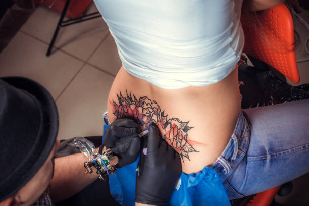istock Tattooer doing tattoo in tatoo salon 1361017951