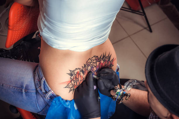istock Tattooer doing tattoo in tatoo salon 1361022812