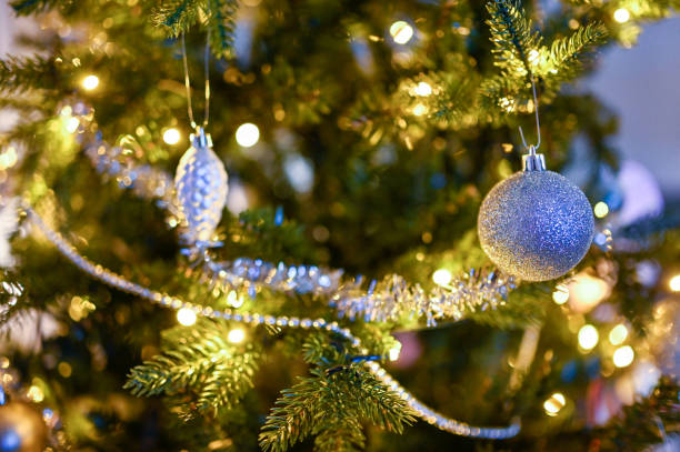istock close up of decorations in Christmas tree indoors 1361025741