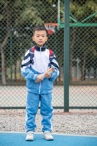 istock Pupils standing on the school playground 1361026716