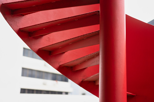 Outdoor metal red spiral staircase
