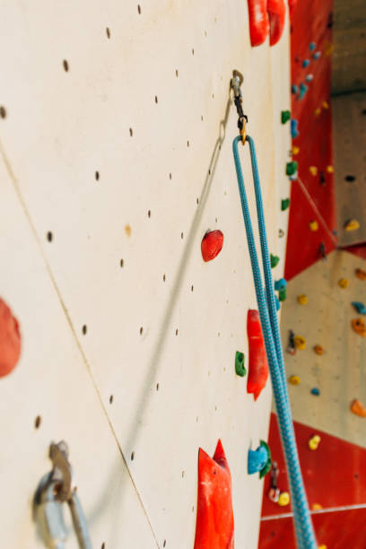 istock Climbing wall with colorful footholds 1361042104
