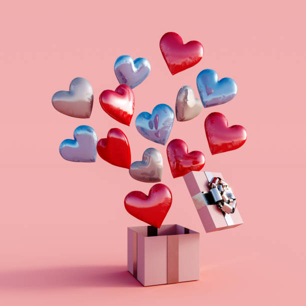 istock Gift box with balloon hearts on pink background 1361047863