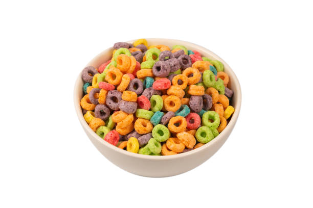 istock Colorful rings cereal spill out into a bowl. Breakfast. Isolated. 1361049274
