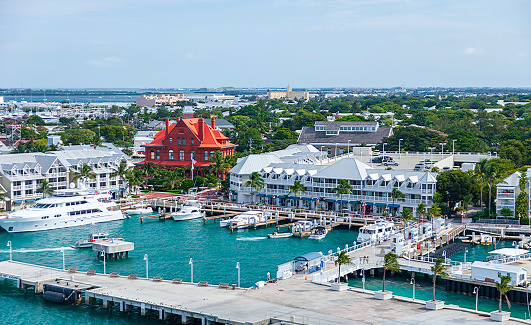 Aerial view of the cruise ship pier, the adjacent marina and commercial center with the city of Key West, Florida in the background