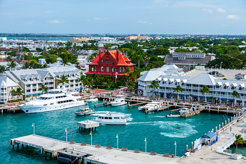 Aerial view of the cruise ship pier, the adjacent marina and commercial center with the city of Key West, Florida in the background