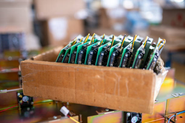 istock Green control chips of TFT monitors in cardboard box in shop 1361053096