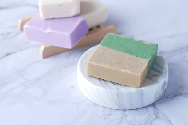 istock Homemade natural soap bar on black background 1361062212