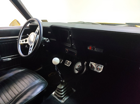 Close up of a old car parked on road