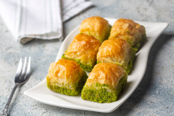 istock Traditional delicious Turkish dessert; pistachio baklava (Turkish name; kuru baklava) 1361081049