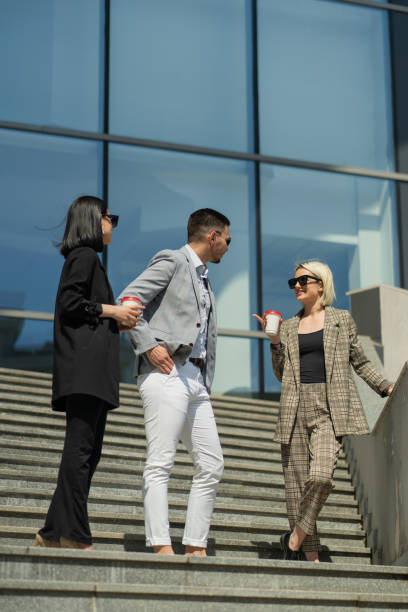 istock Three business people are talking on their break 1361082707
