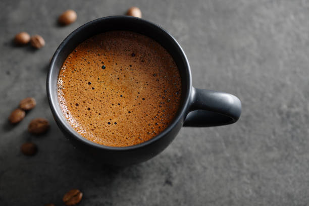 istock Coffee beans in small bowls on wooden 1361083394
