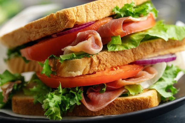 istock Tasty sandwich with vegetables and meat 1361083447