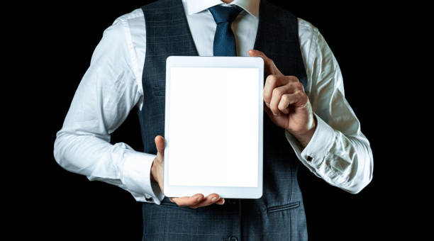Screen mockup. Empty blank tablet in businessman hand. Mock up screen smart device isolated on black banner background. Game design, mobile application presentation or portfolio mockups. Screen mockup. Empty blank tablet in businessman hand. Mock up screen smart device isolated on black banner background. Game design, mobile application presentation or portfolio mockups kindle stock pictures, royalty-free photos & images