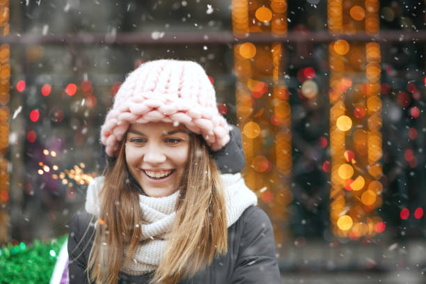istock Emotional lady playing with sparklers during the snowfall 1361086027