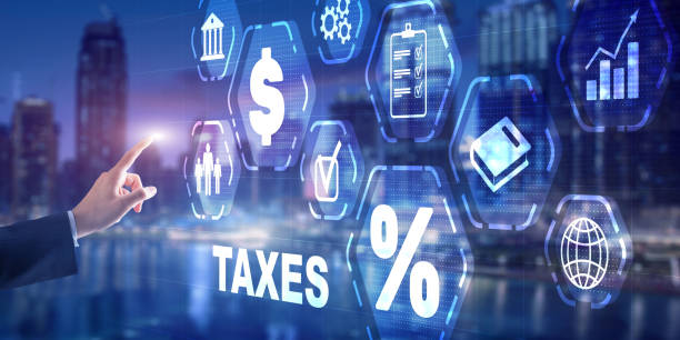 istock Tax payment. Businessman using virtual touchscreen presses tax button 1361089178