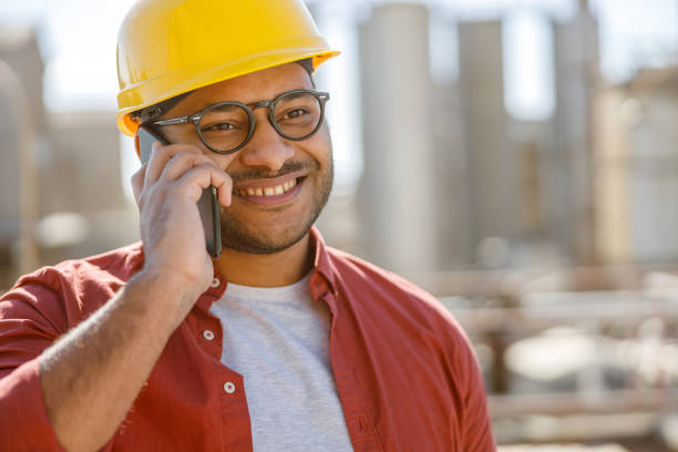 istock Smiling young industrial engineer working in plant 1361092382