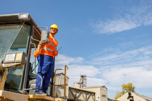 istock Multiracial construction worker using heavy machinery in plant 1361092465