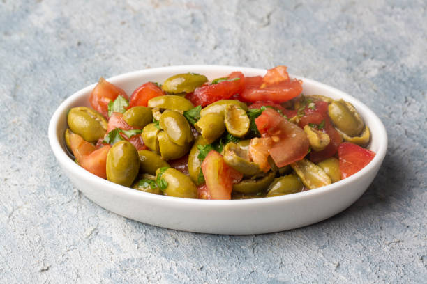 gourmet flavors from traditional turkish cuisine; green olive salad (turkish name; kirma yesil zeytin salatasi) a flavor belonging to the turkey - antakya region. - 16636 imagens e fotografias de stock