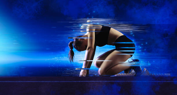 istock Woman sprinter leaving starting blocks 1361102956