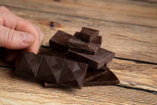istock Dark chocolate on a wooden background. 1361103190