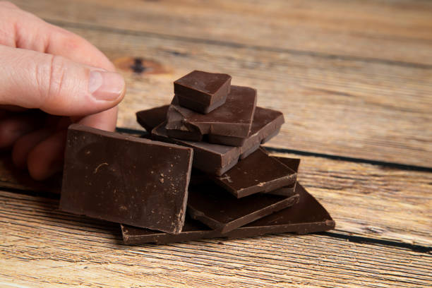 istock Dark chocolate on a wooden background. 1361103195