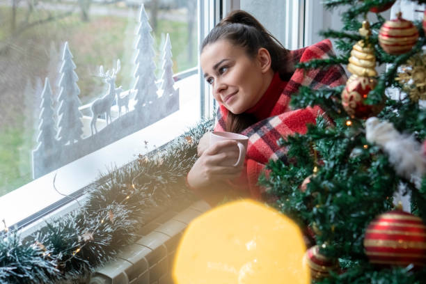 istock Young woman for Christmas at home 1361110399