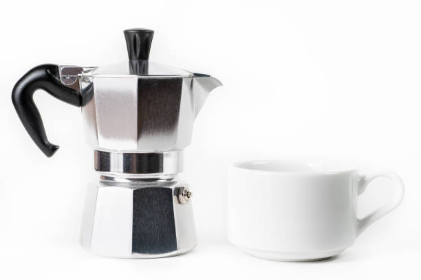istock Traditional Italian coffee maker Moka pot and cup on white background 1361111395