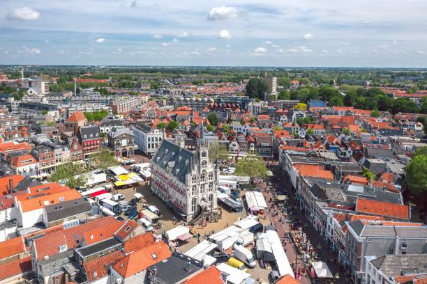 Cheese market in Gouda, Netherlands Gouda, South Holland, Netherlands - June 2021: Saturday's market at the Town Hall square cheese market stock pictures, royalty-free photos & images