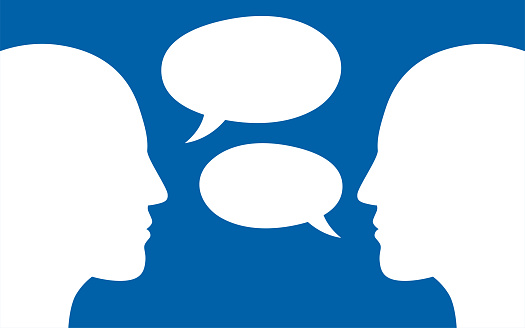 Two human heads silhouette talking through speech bubbles. Dialogue,contact, conversational exchange between two individuals. Vector illustration.