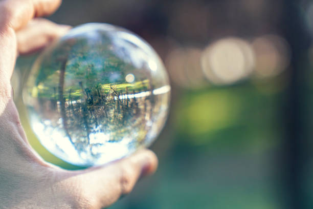 istock hand with crystal ball Sunset 1361119303