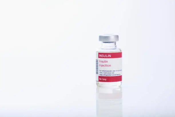 Insulin vial on white