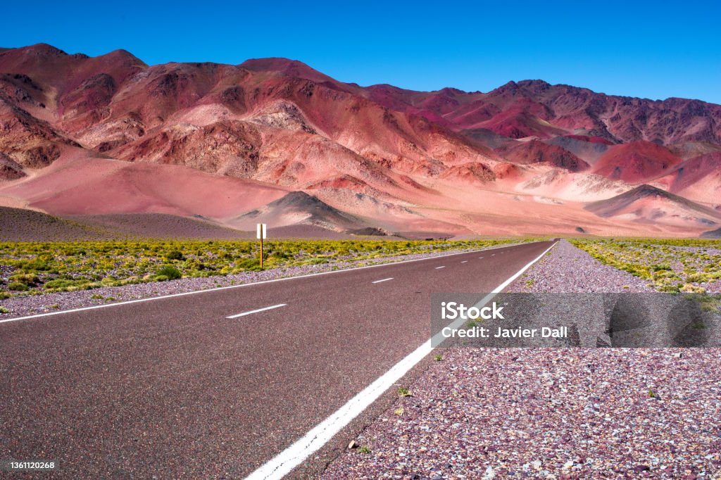 Route to the mountains. Straight path that takes you into the mountains. Argentine landscapes Argentina Stock Photo