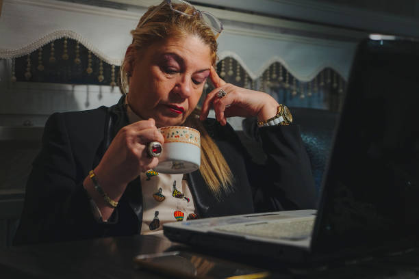 istock Senior businesswoman having headache 1361121439