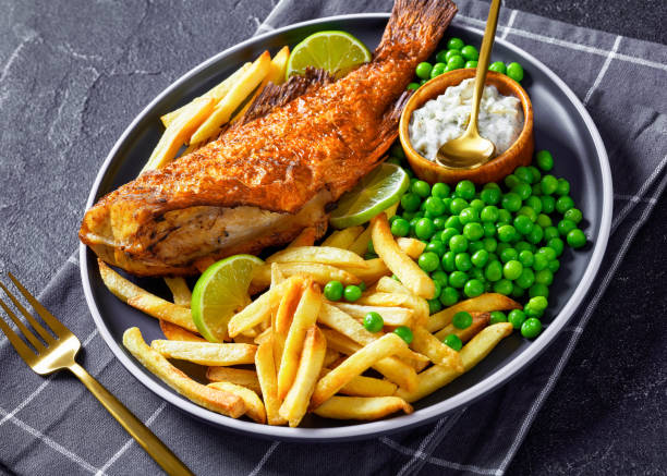 istock fried redfish with chips, green peas, tartar sauce 1361124933