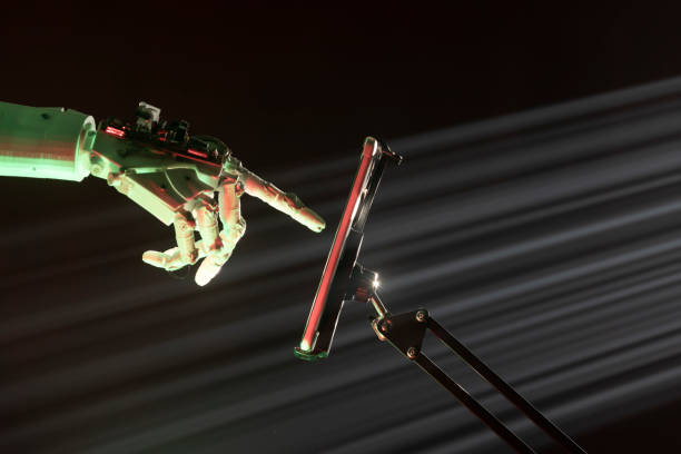 istock Photo Of Humanoid Robot Hand Using Digital Tablet 1361126785
