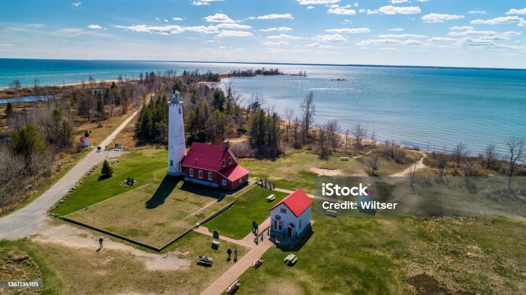 Tawas Point Lighthouse Looking Southeast Tawas Point Lighthouse. I visited the lighthouse in April before it got to busy. I used the DJI Phantom 4 drone Michigan Stock Photo
