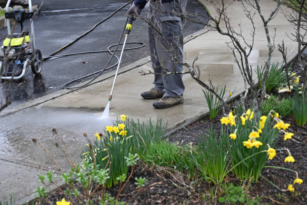 istock man washing off dirt. Men uses power washer, spring cleaning 1361144548